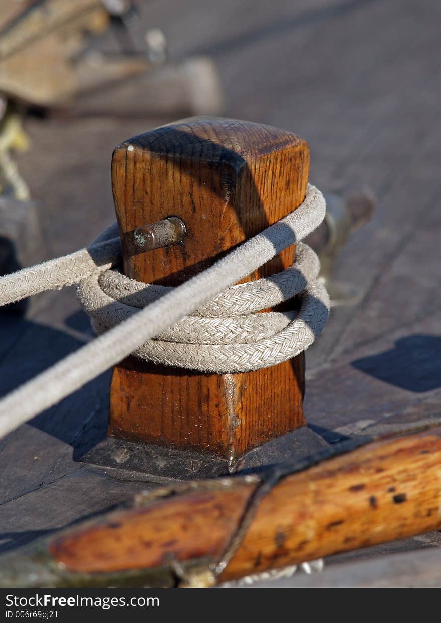 A wooden make-fast on a yacht deck