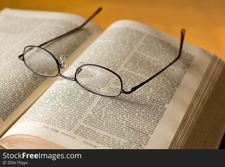 Glasses on the book close-up. Glasses on the book close-up