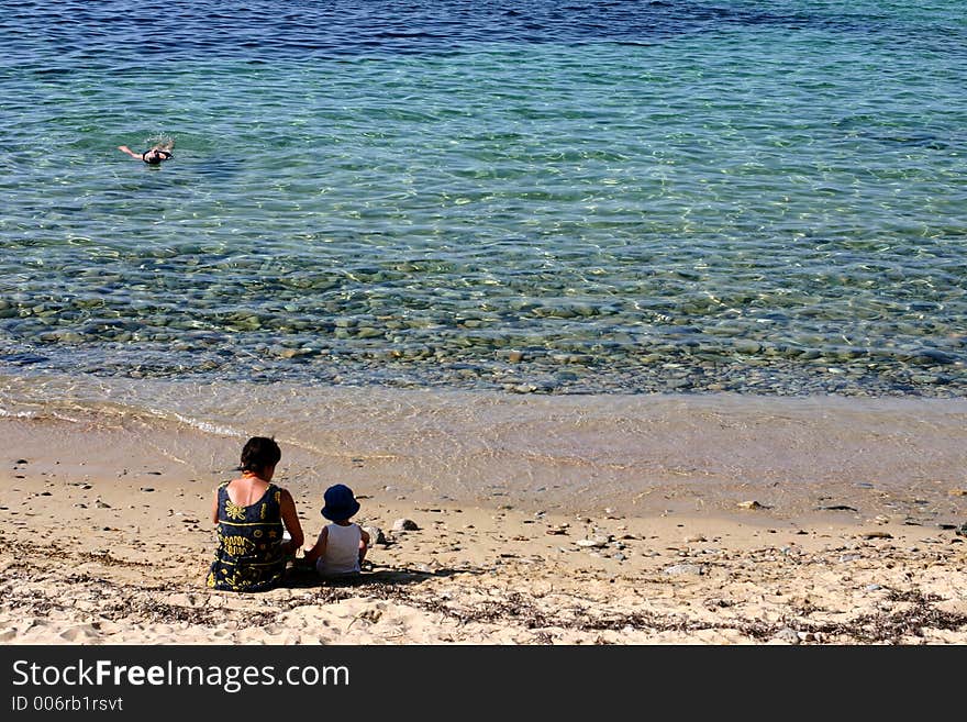 Corsica   Bay of Calvi, people on the beach. Corsica   Bay of Calvi, people on the beach