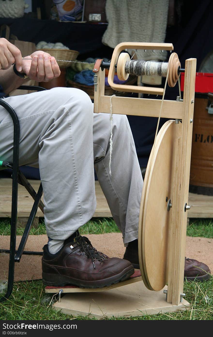 Modern spinning wheel in action. Modern spinning wheel in action