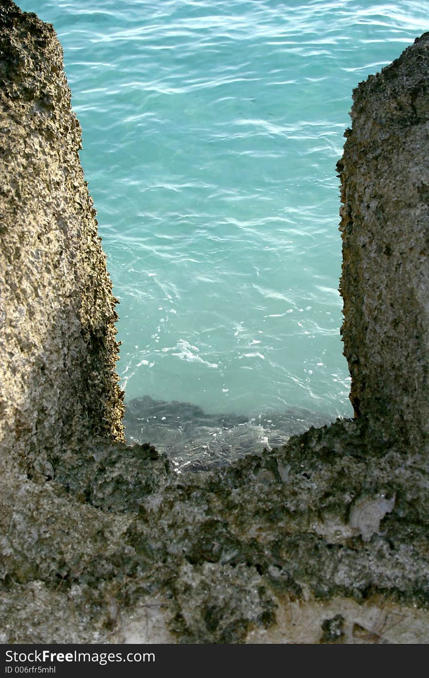 Sharp steps lead to clear blue water.