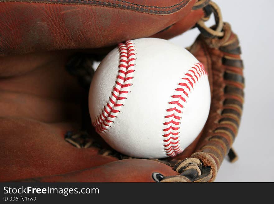 Baseball and glove in closeup