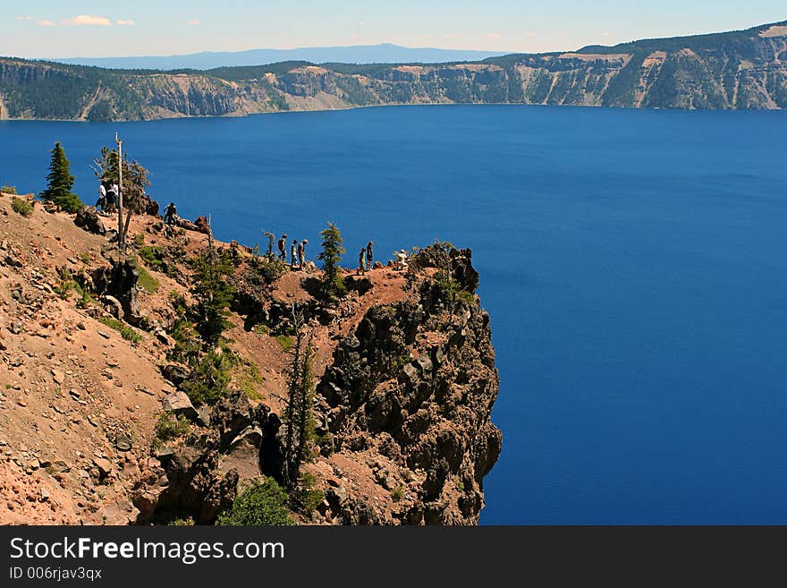 Cliff with tourists at Crater Lake, Oregon. Cliff with tourists at Crater Lake, Oregon