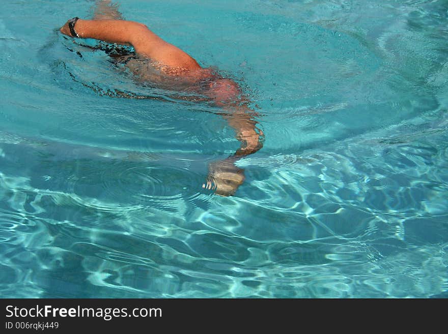 Man Swimming in a pool. Man Swimming in a pool