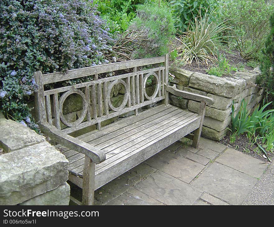 Old bench in Queens park in London