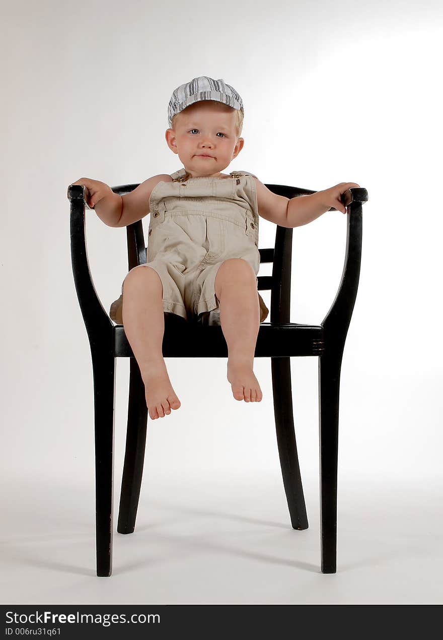 Little boy with a chair. Little boy with a chair