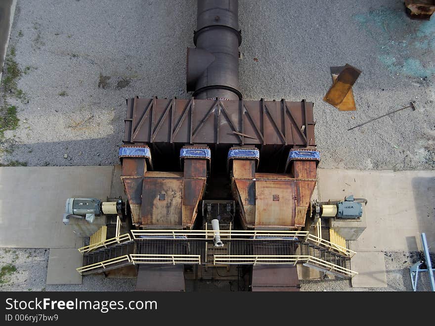 Furnace manifold fans leading to an industrial stack.