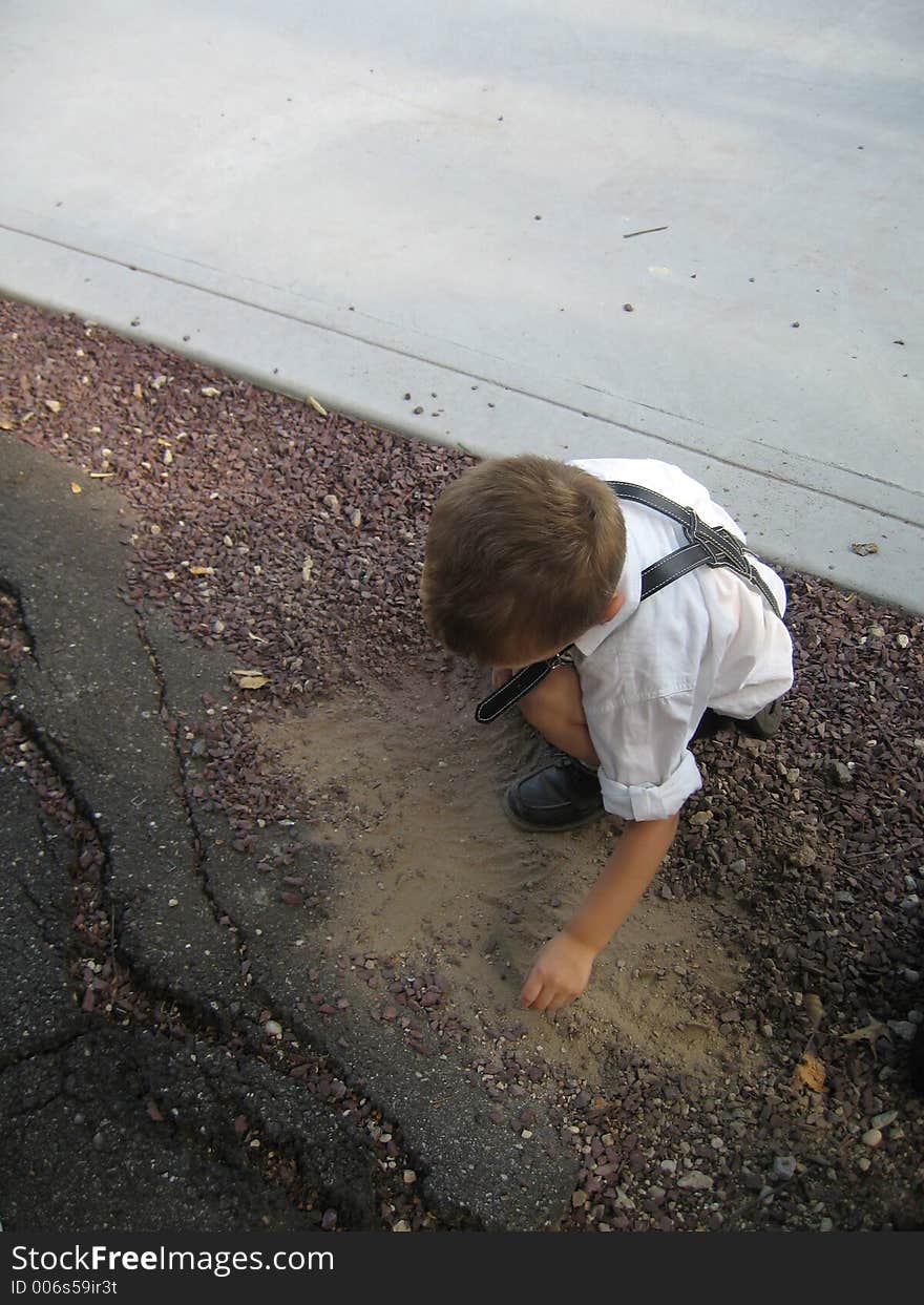 German child playing in dirt