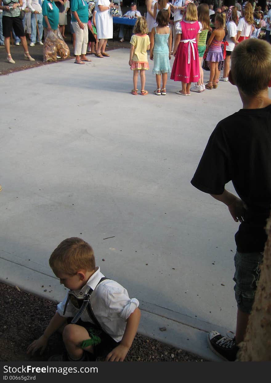 People at german festival, boys in foreground