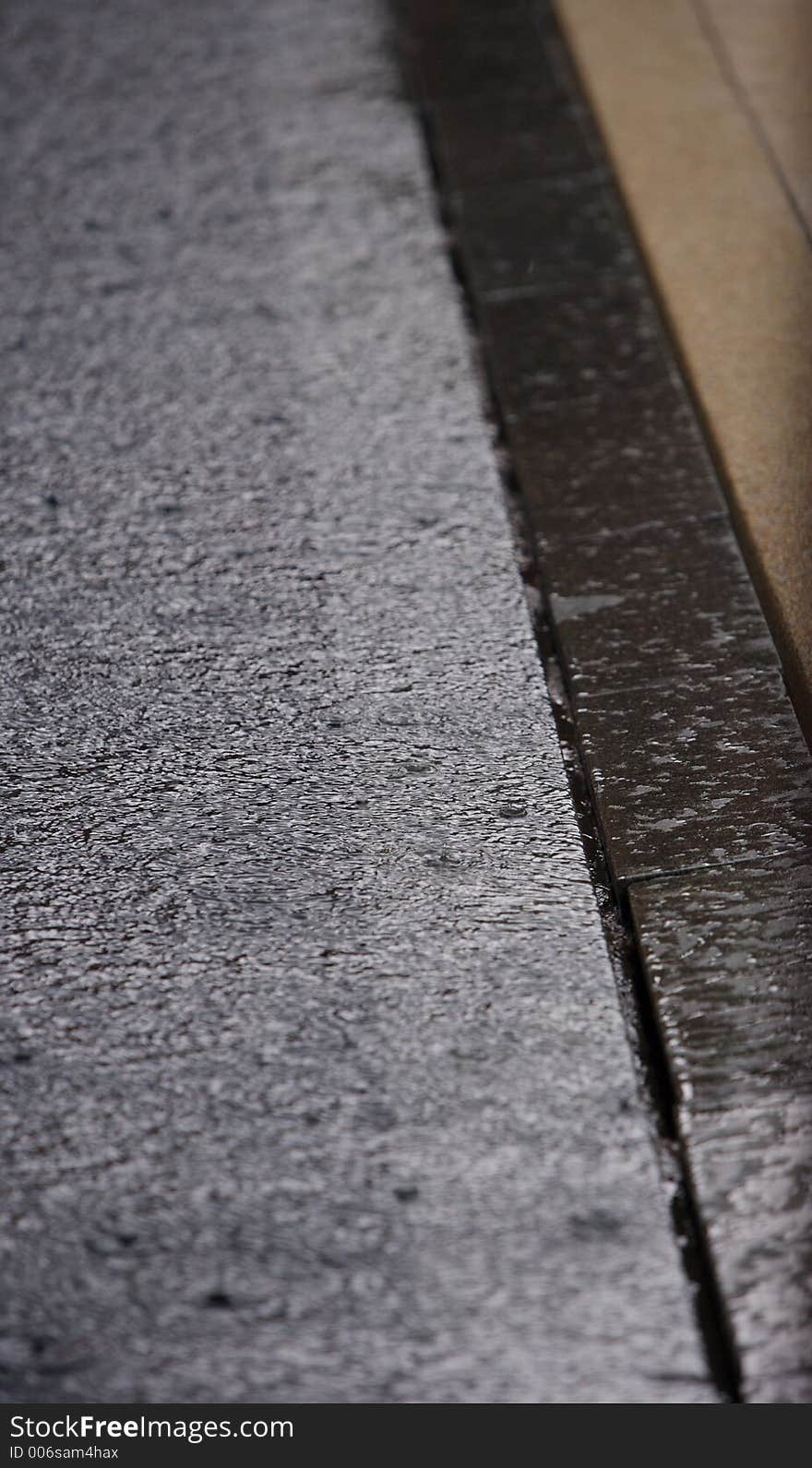 Detail shot of a zero edge pool with the afternoon showers at a resort pool in Phuket. Detail shot of a zero edge pool with the afternoon showers at a resort pool in Phuket