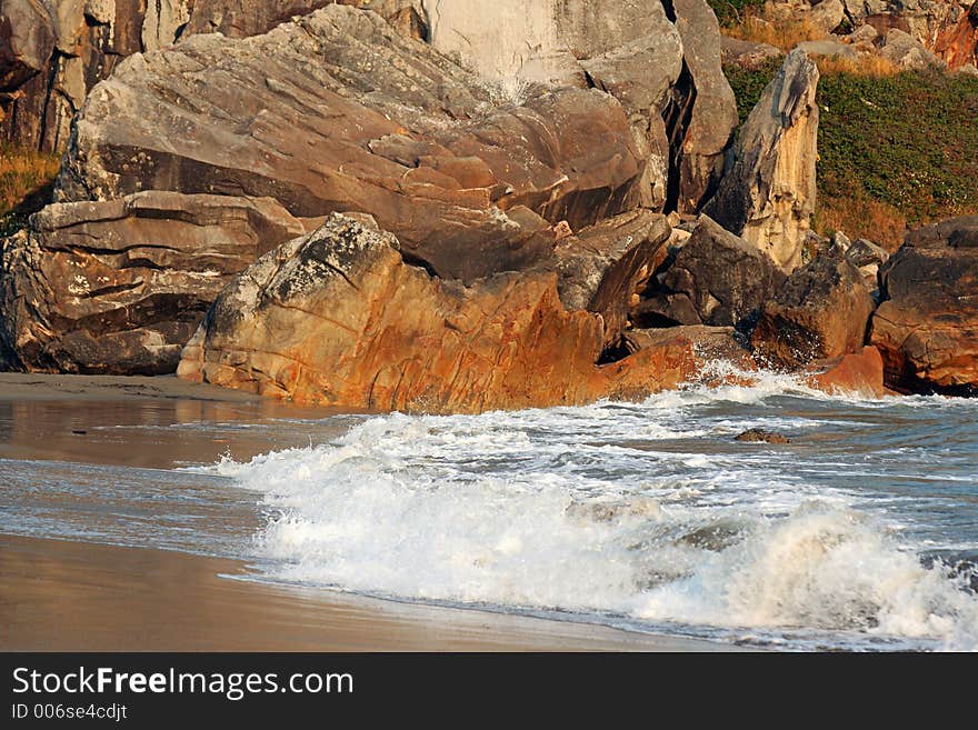 Red Rocks And Crashing Waves