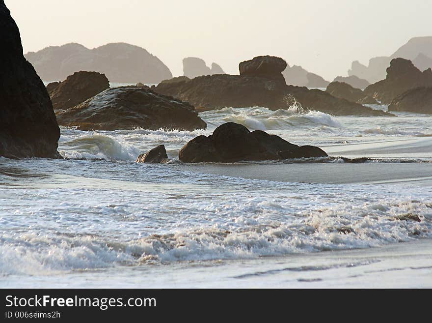 Rocks and waves at sunset, Harris Beach State Park, Brookings, Oregon. Rocks and waves at sunset, Harris Beach State Park, Brookings, Oregon