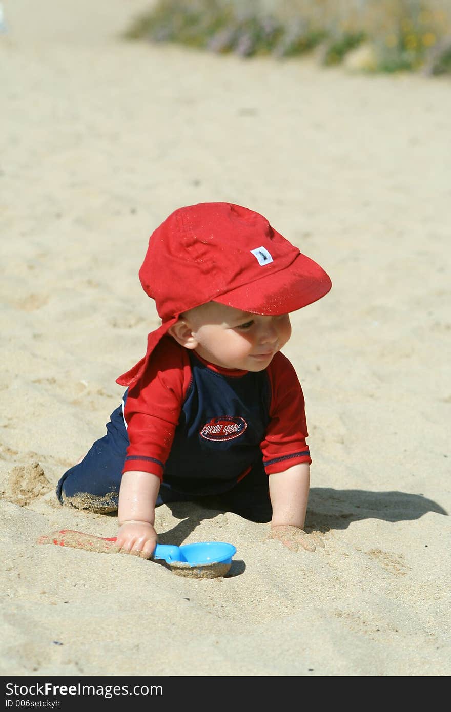 Small child exploring a beach in Cornwall. Small child exploring a beach in Cornwall.