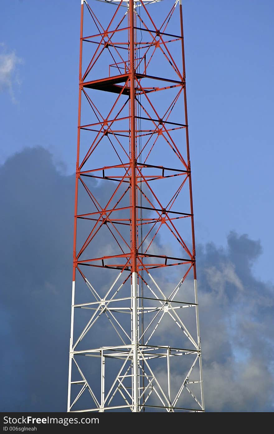 Telecommunication tower over a beautiful afternoon sky