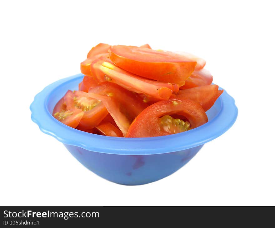 Tomato salad in blue bowl isolated on white