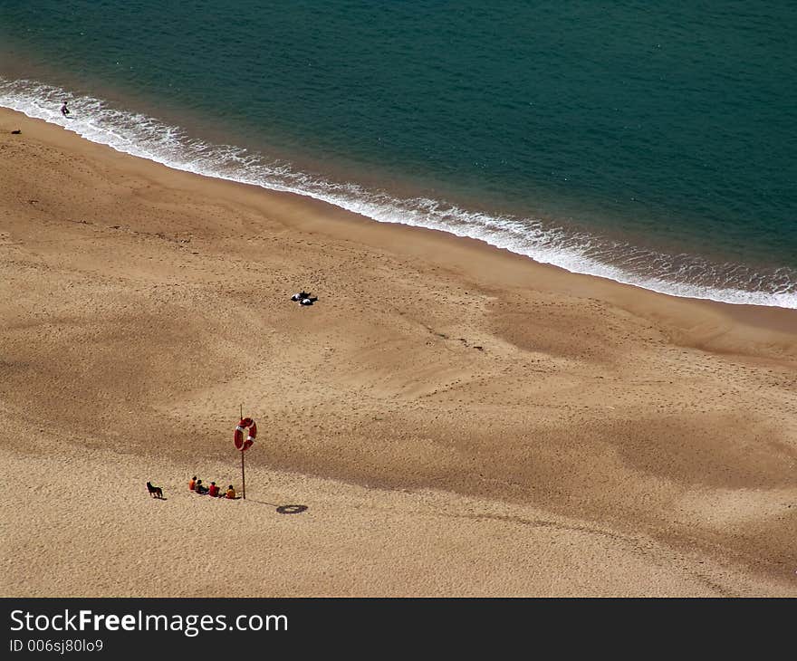 Beach with life-buoy