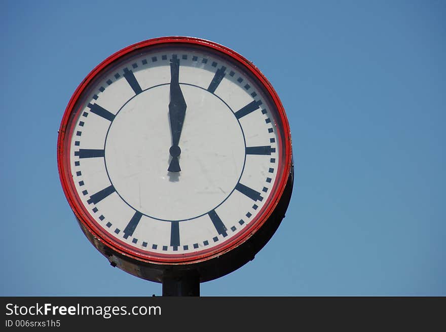 Big round red and white clock. Standard Amsterdam city clock.