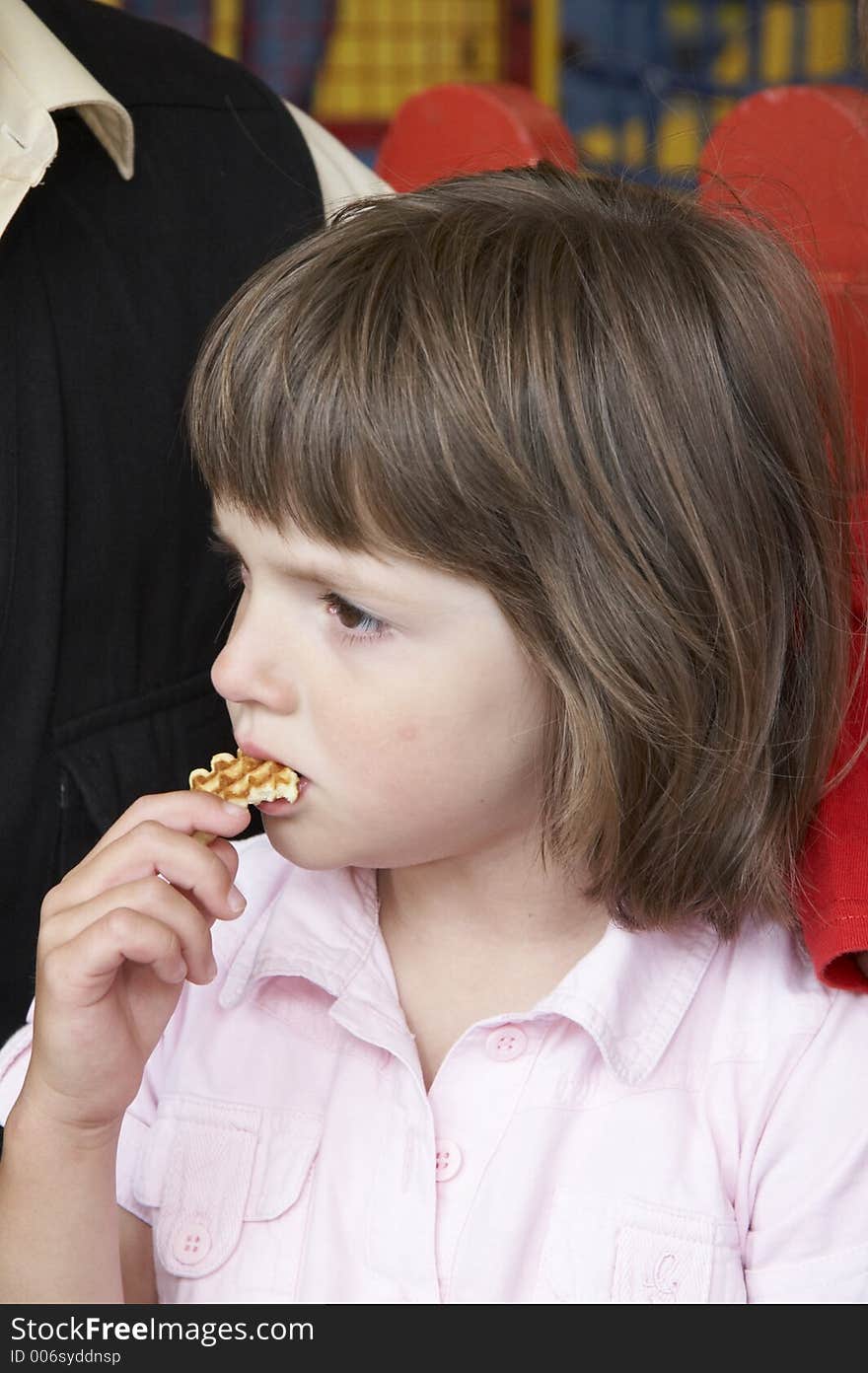 Young girl eating cake. Young girl eating cake