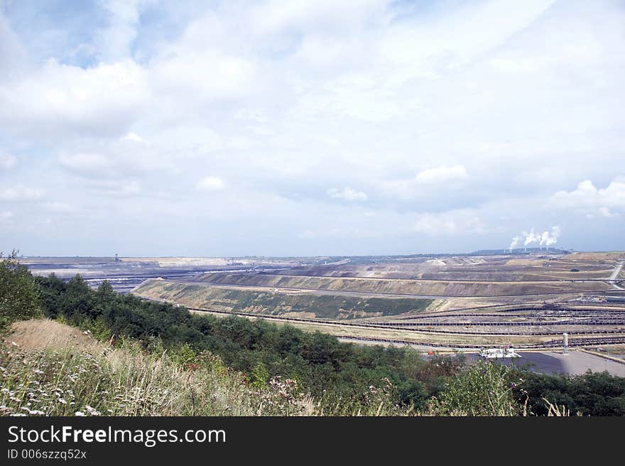 Brown coal open-cast mining with fired power station. Brown coal open-cast mining with fired power station