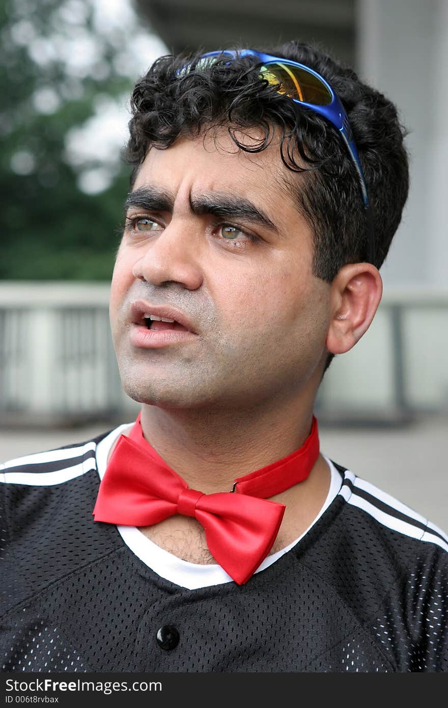 Indian man wearing a red bow tie. Indian man wearing a red bow tie