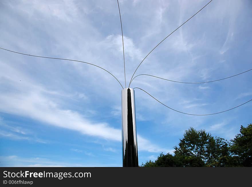 The artistic column on the blue sky. The artistic column on the blue sky