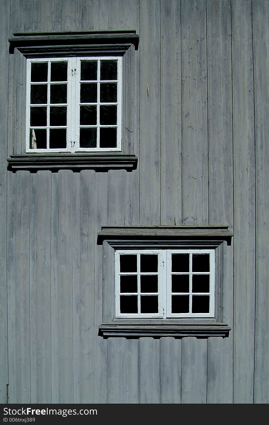 Two Windows On A Gray Wall