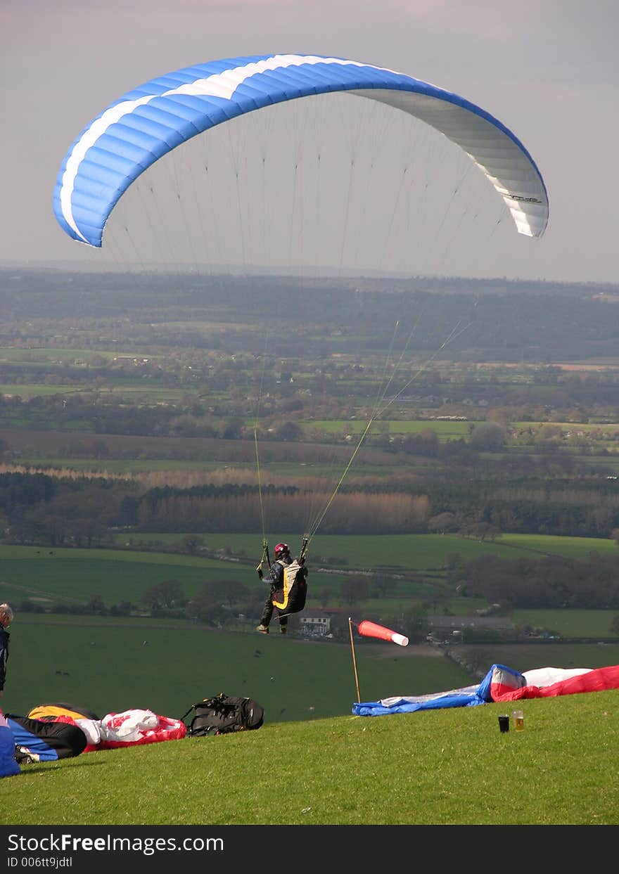 Paraglider takes of into clear air. Paraglider takes of into clear air