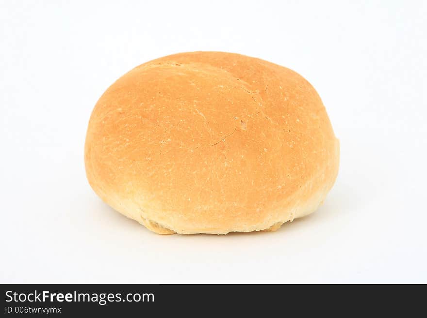 Healthy plain brown bread roll, close-up over white, isolated, macro, closeup, shallow dof. Healthy plain brown bread roll, close-up over white, isolated, macro, closeup, shallow dof