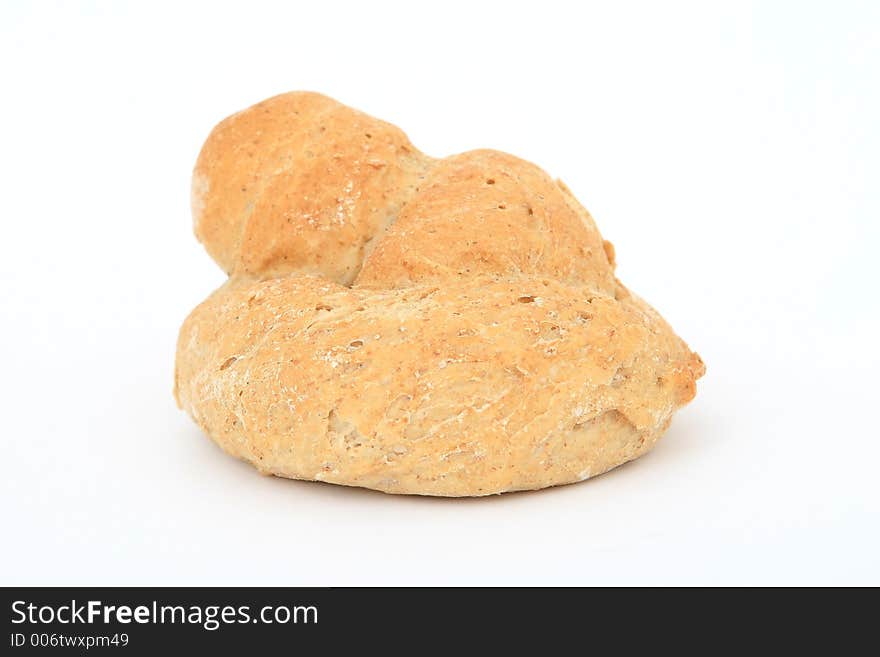 Healthy plain brown bread roll, close-up over white, isolated, macro, closeup, shallow dof. Healthy plain brown bread roll, close-up over white, isolated, macro, closeup, shallow dof