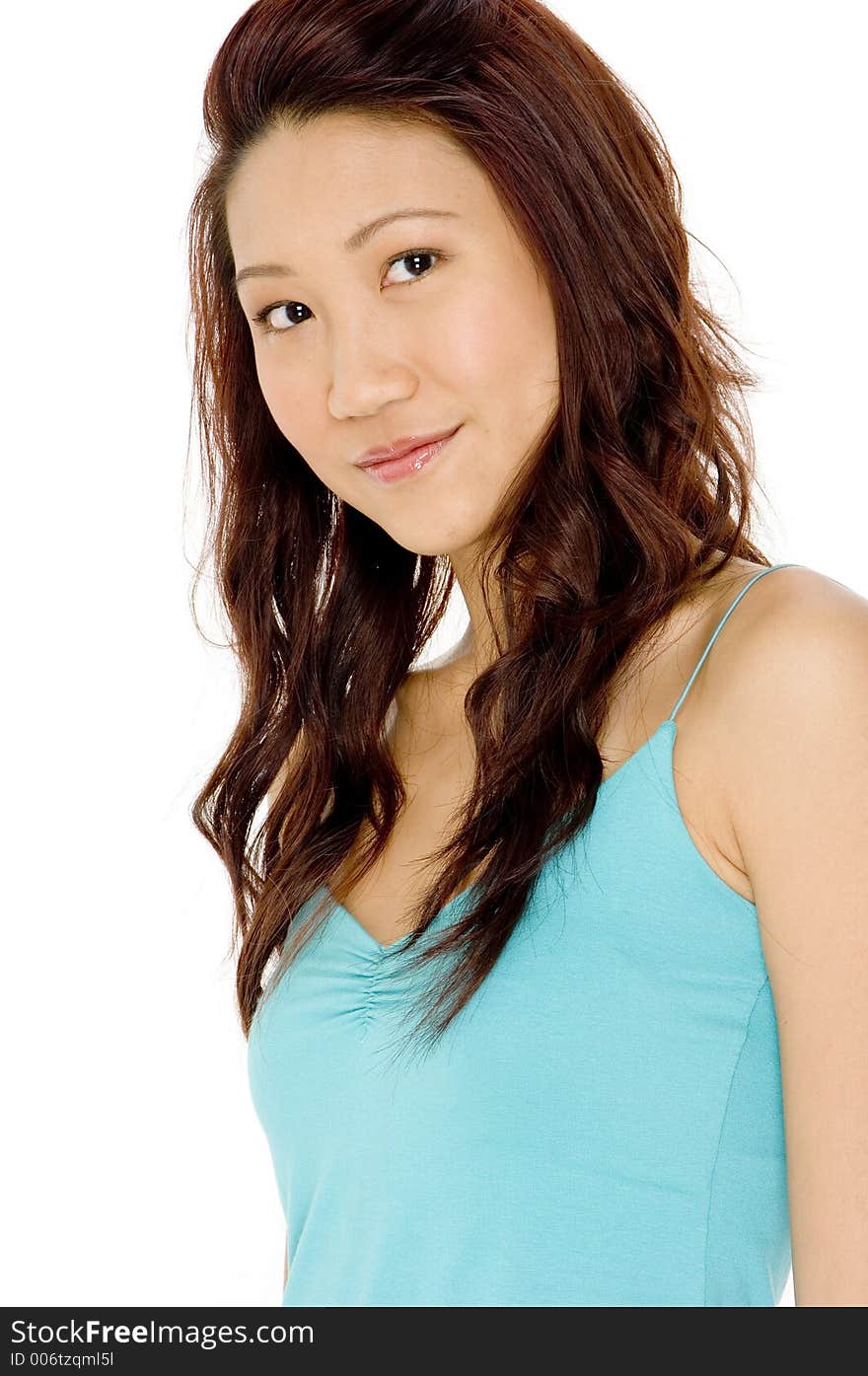 A pretty young asian woman in blue top on white background. A pretty young asian woman in blue top on white background