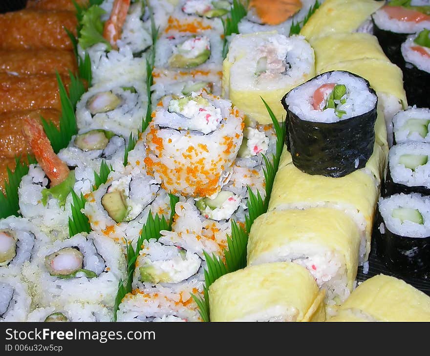 A platter of various kinds of sushi...shrimp tempura, california rolls, salmon rolls, cucumber rolls, and the house special. A platter of various kinds of sushi...shrimp tempura, california rolls, salmon rolls, cucumber rolls, and the house special