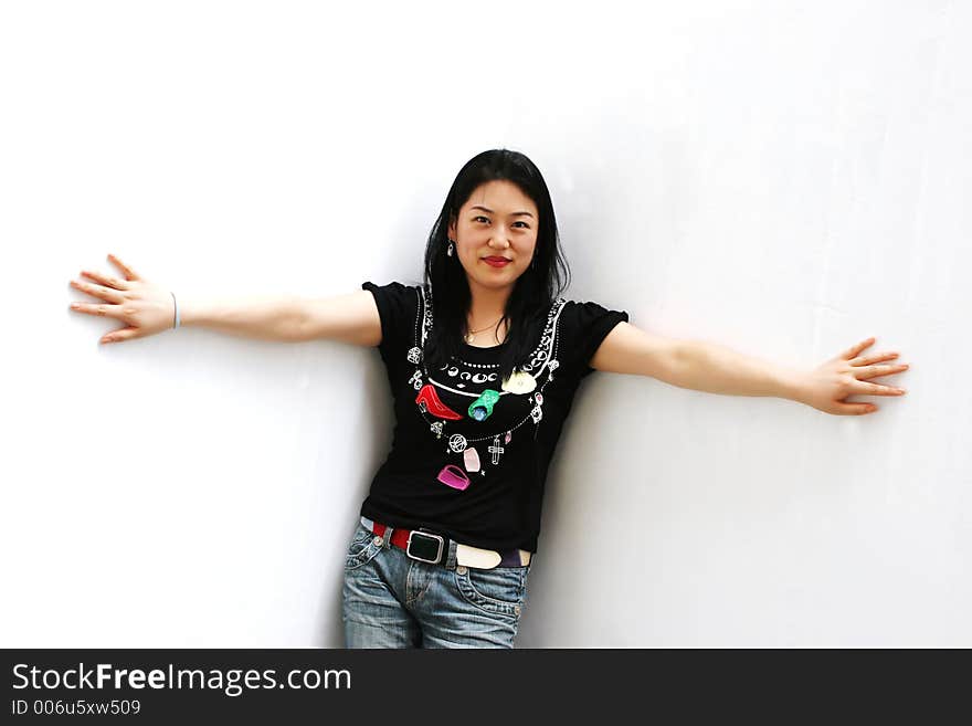 Portrait Of A Korean Woman In Jeans And A T-shirt