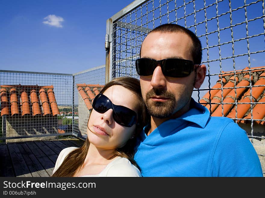 Lady on his shoulder with sunglasses. Lady on his shoulder with sunglasses