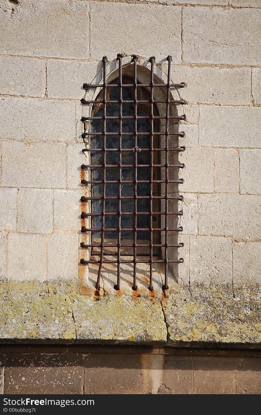 A tight old grid on an ancient window. A tight old grid on an ancient window