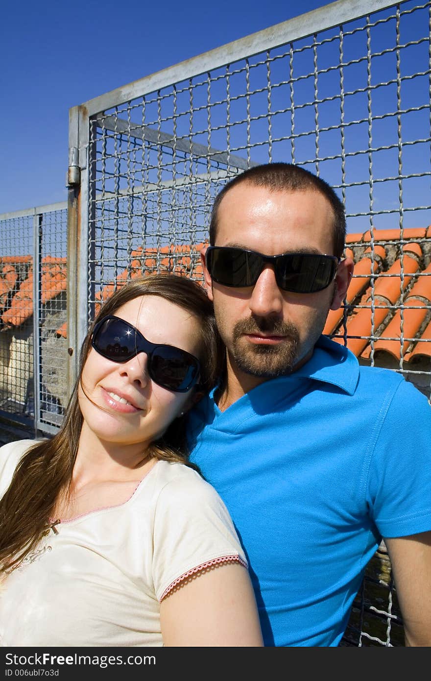 Brunette on man shoulder with smile. Brunette on man shoulder with smile