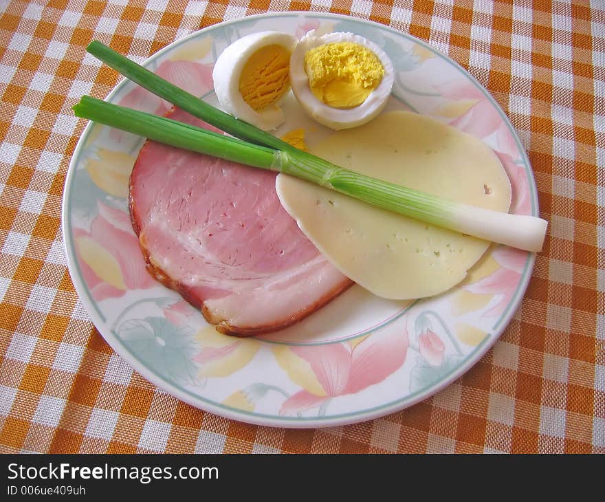 Traditional domestic Easter food in Croatia: boiled ham, cheese, young green onion, boiled eggs. Traditional domestic Easter food in Croatia: boiled ham, cheese, young green onion, boiled eggs...