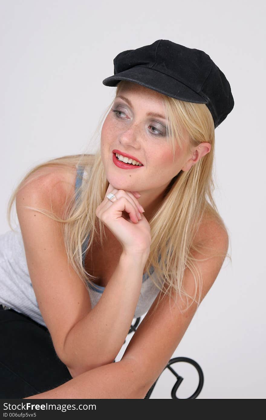 Beautiful blond girl with black hat. Beautiful blond girl with black hat