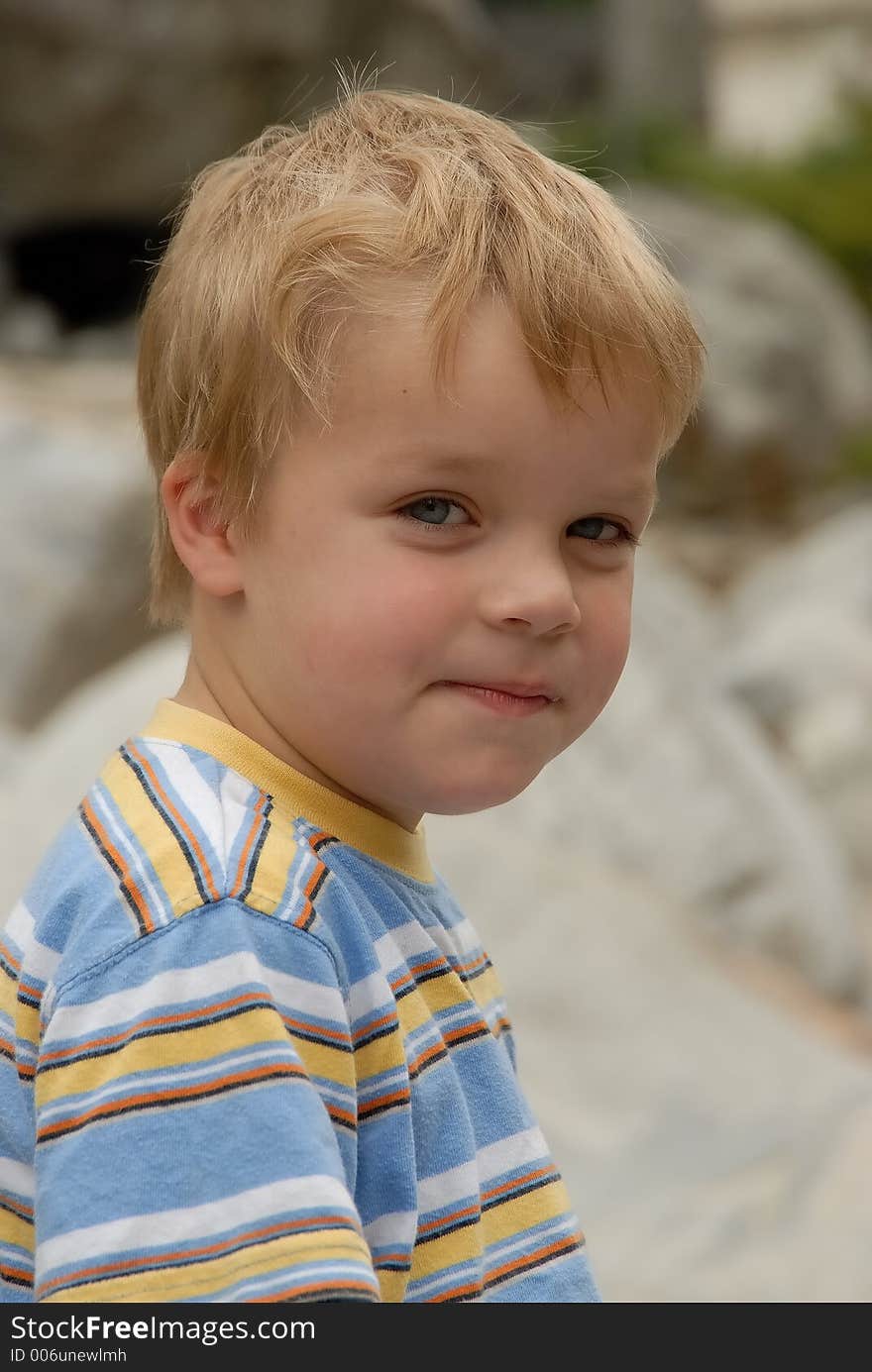 Young child portrait photographed outdoors. Young child portrait photographed outdoors