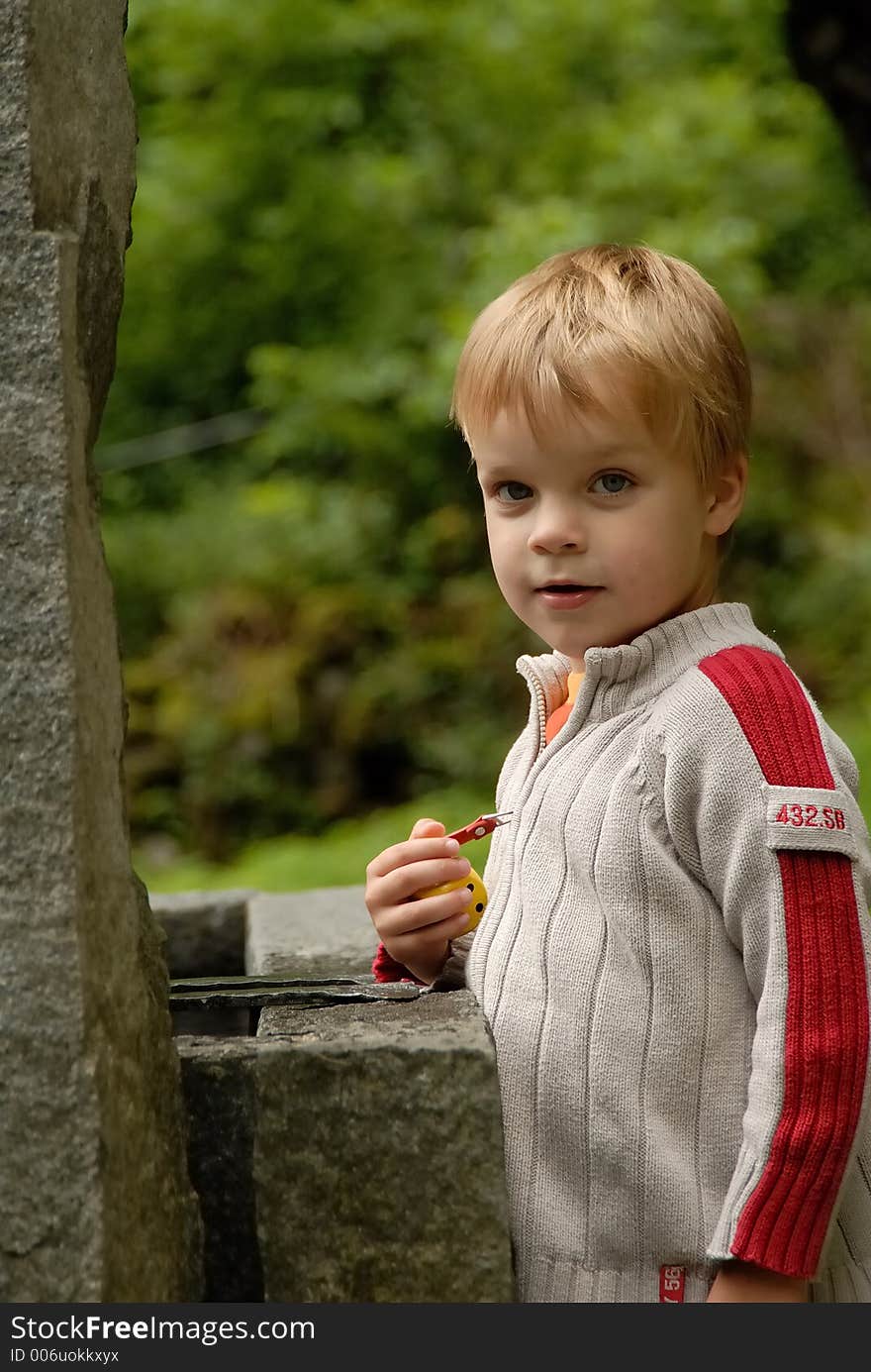 Young child portrait photographed outdoors. Young child portrait photographed outdoors