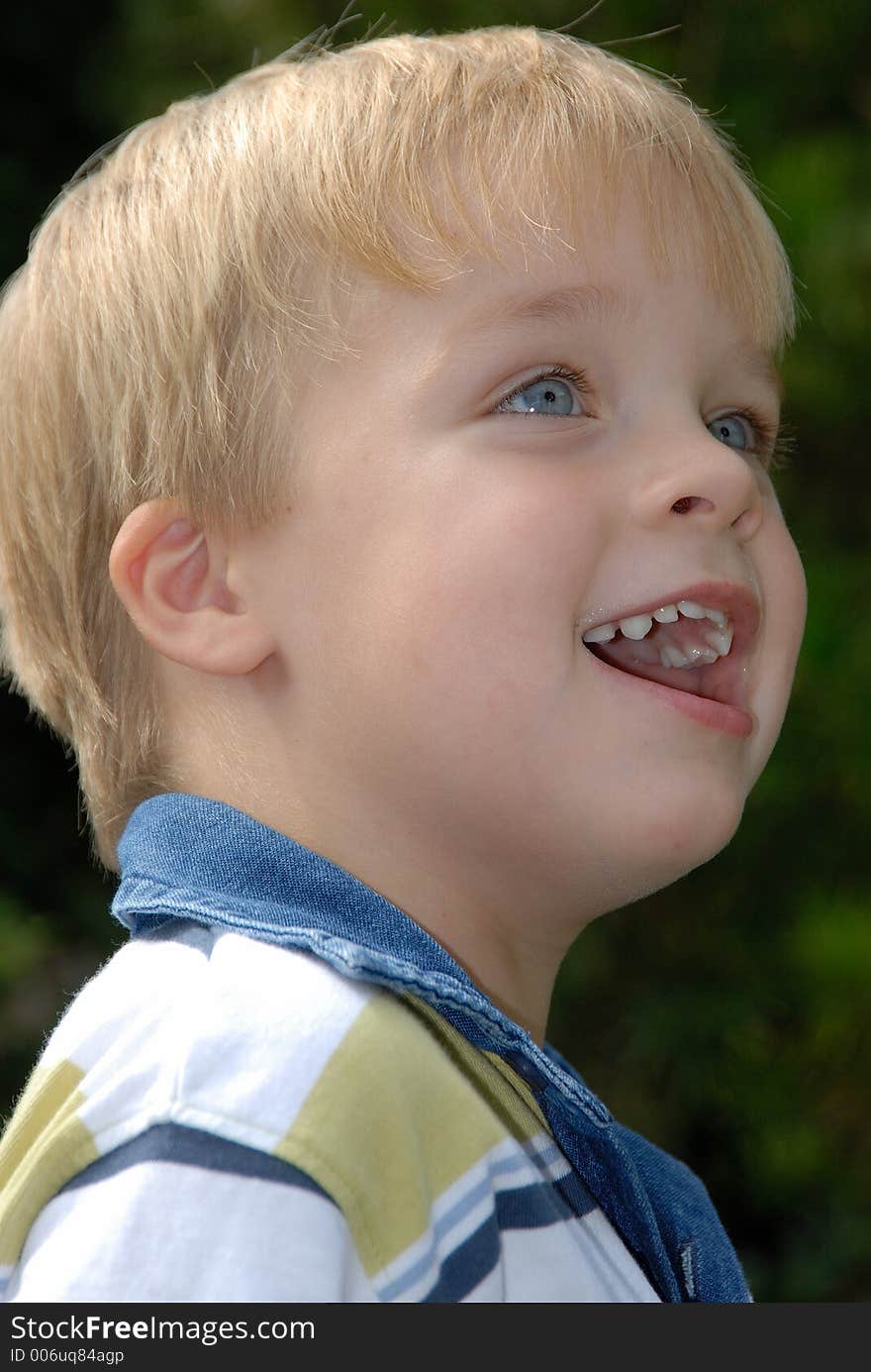 Young child portrait photographed outdoors. Young child portrait photographed outdoors