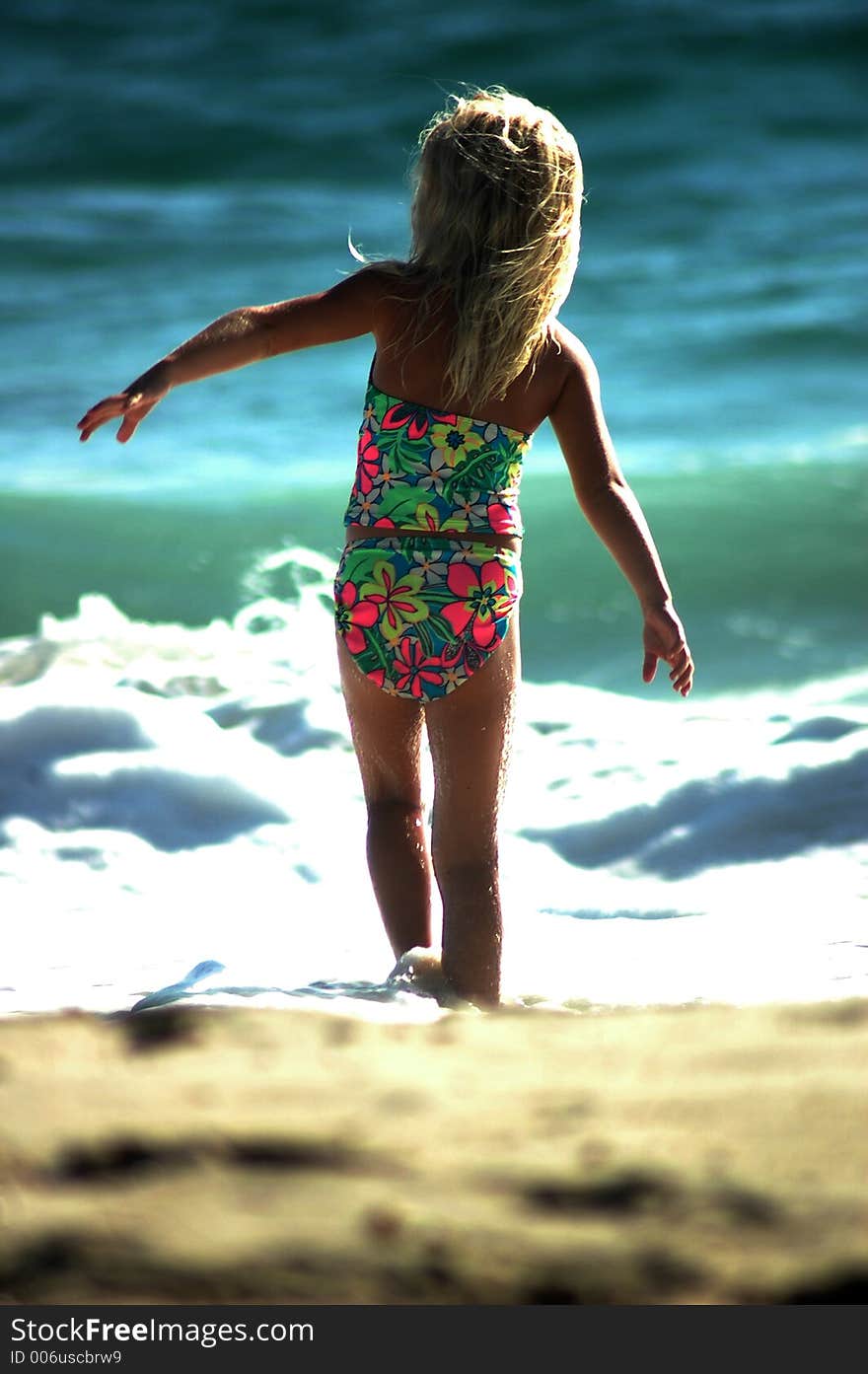 A girl is dancing on the beach. A girl is dancing on the beach.