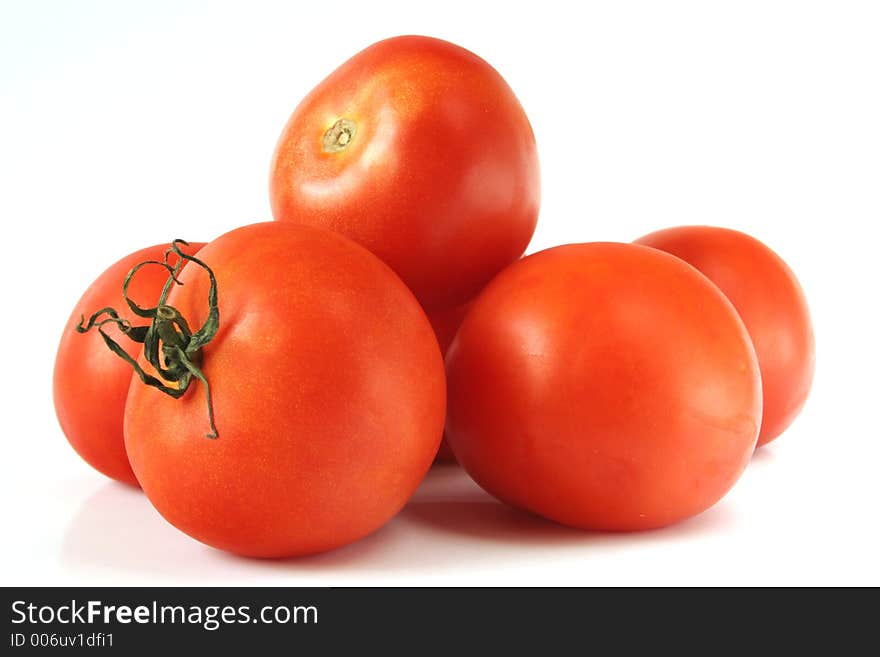 Red tomatoes isolated over white background