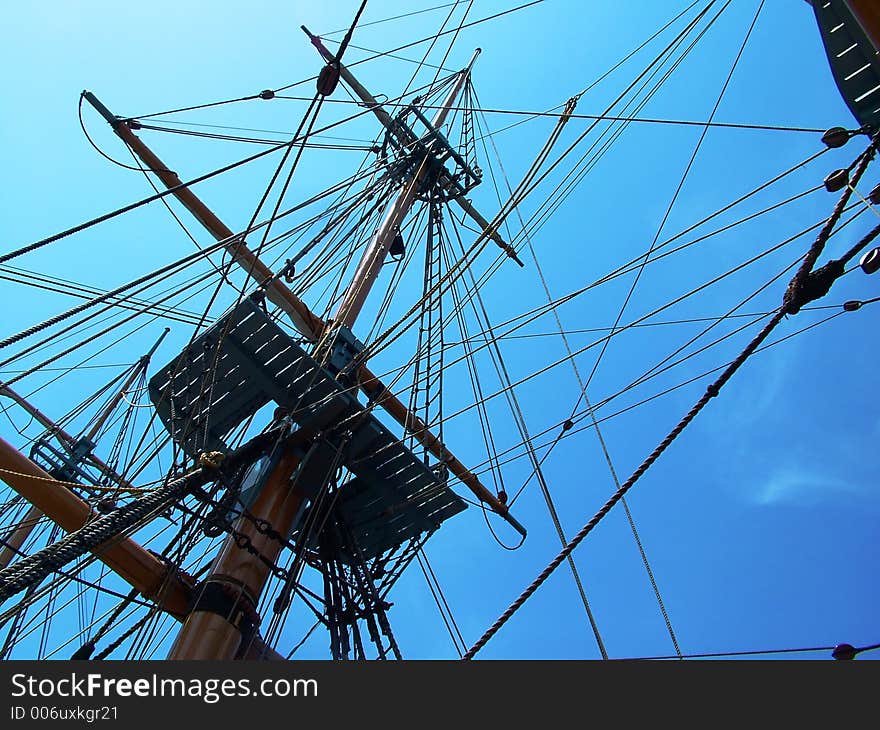 Shipping rigging against blue sky. Shipping rigging against blue sky