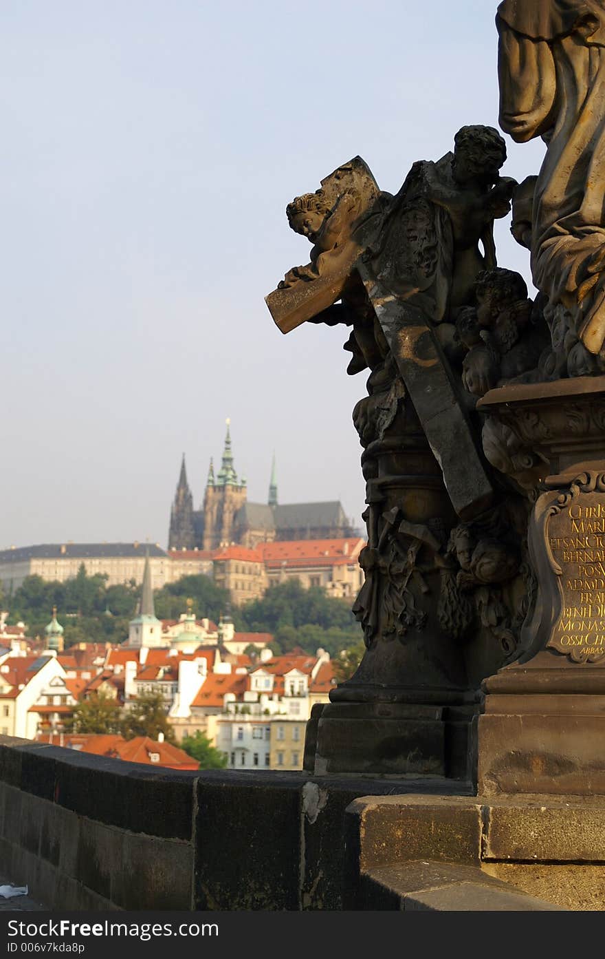 Statue on charles bridge and the Prague castle