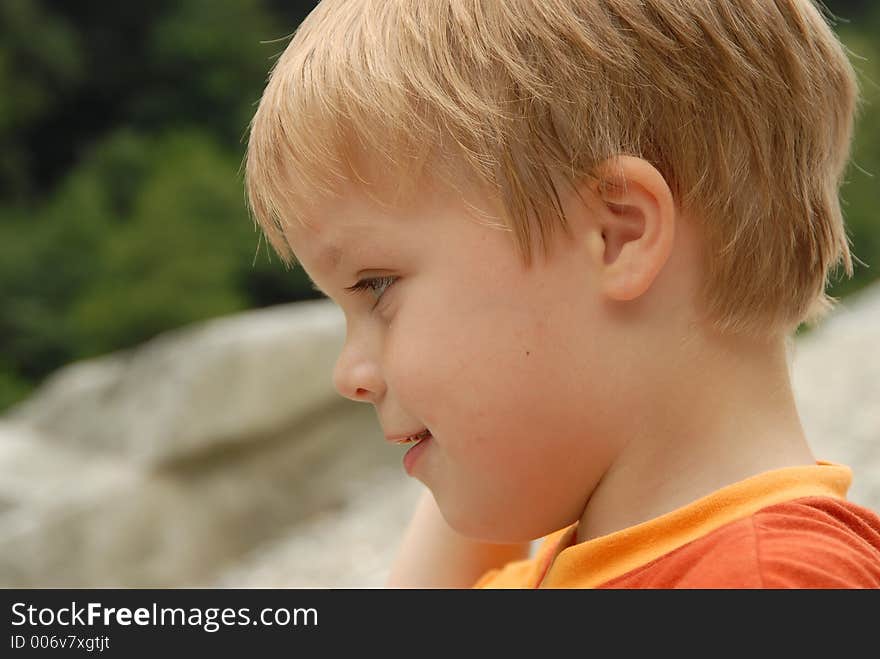 Young child portrait photographed outdoors. Young child portrait photographed outdoors