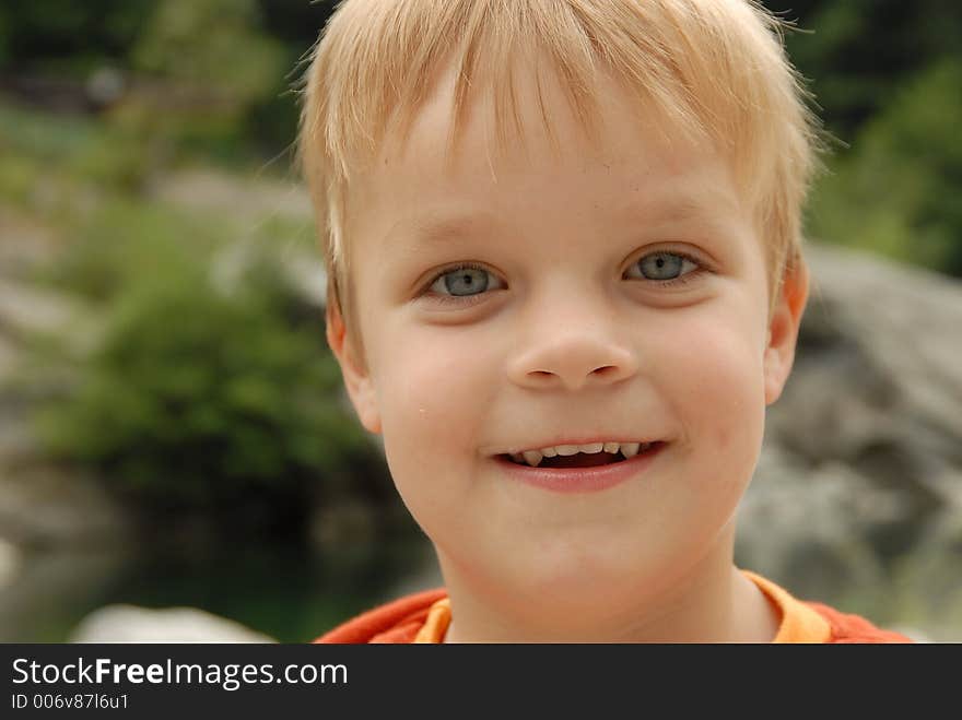 Young child portrait photographed outdoors. Young child portrait photographed outdoors