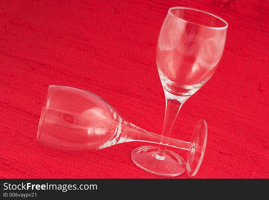 Wine glasses on red background