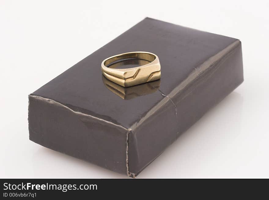 Wedding ring on black box