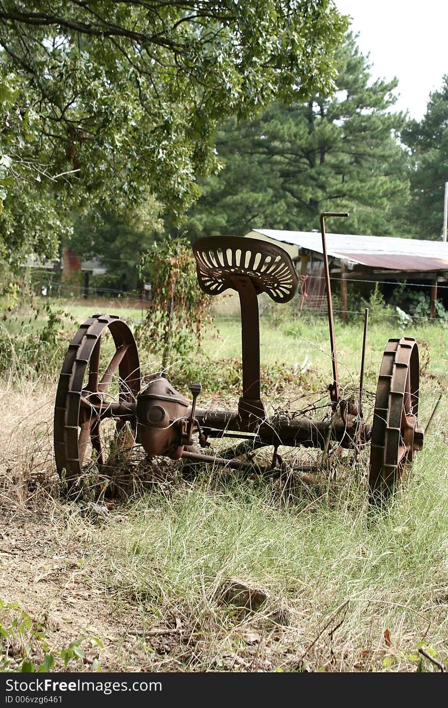 Antique farm equipment in a field. Antique farm equipment in a field