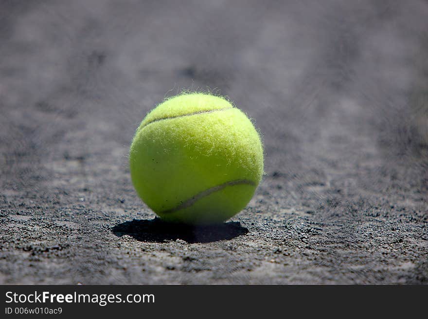 Tennis ball on ground